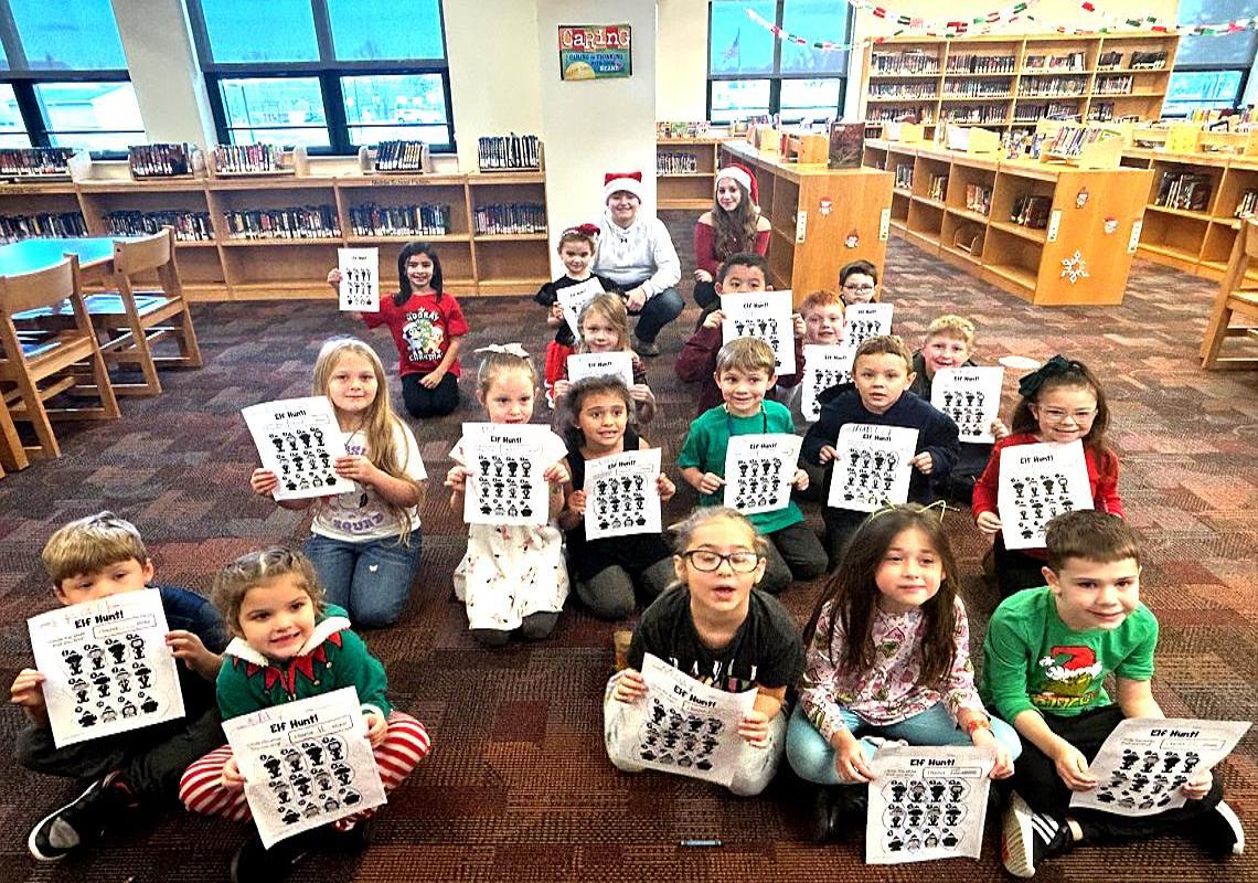 The annual holiday tradition of 8th grade students helping with the elementary library program 