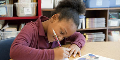 young girl writing