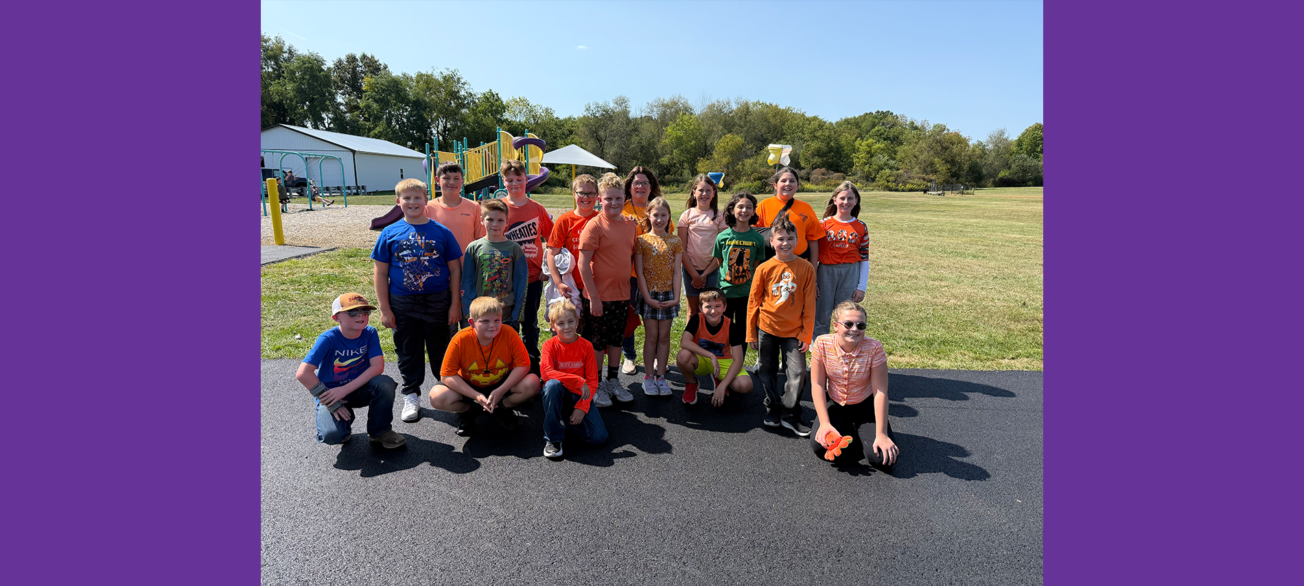 Elementary students dressed in orange to raise awareness for hunger action month