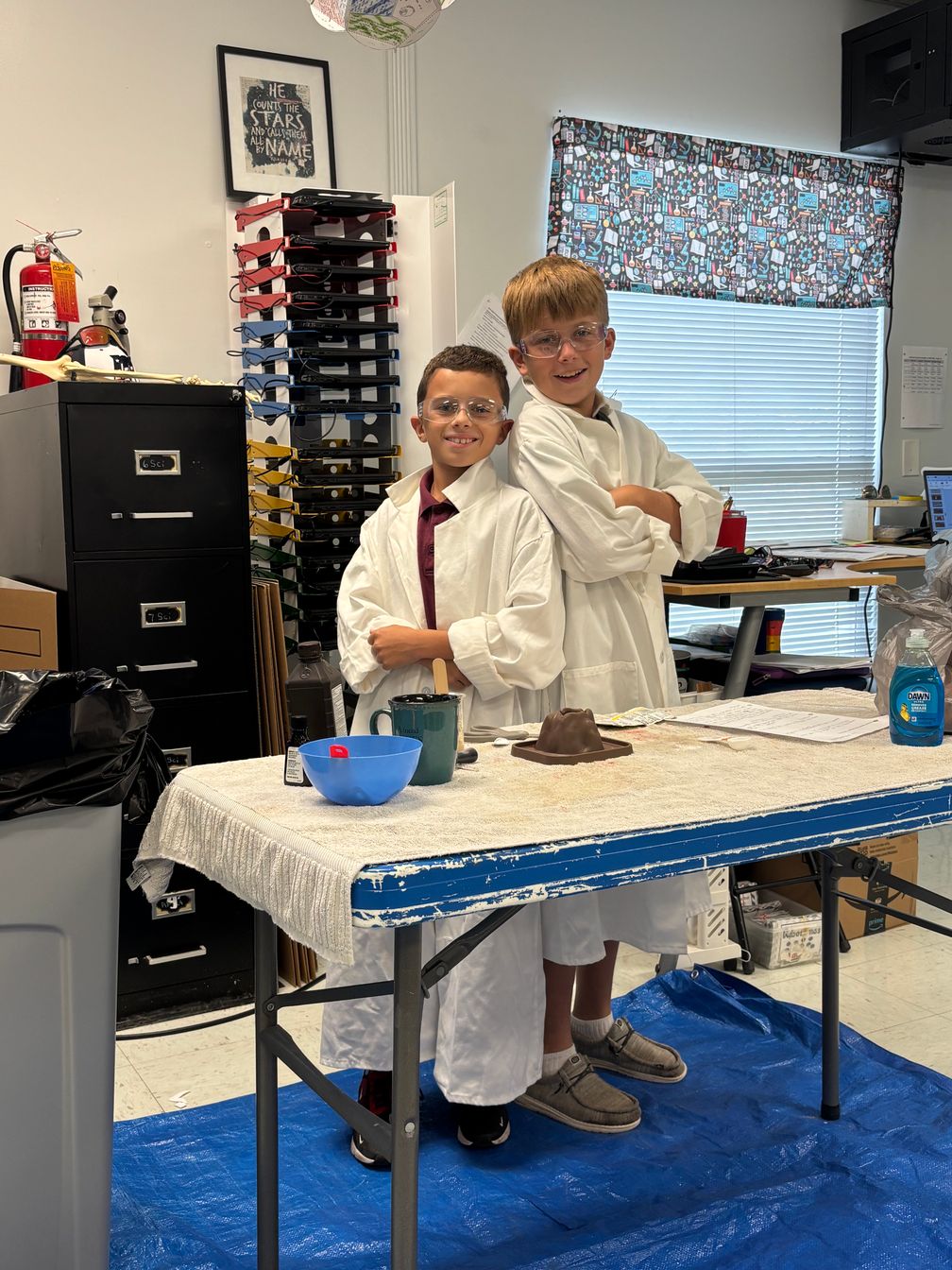lower school students in lab coats 