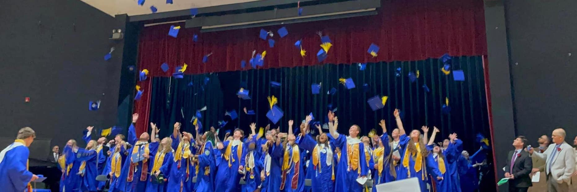 2023 Graduates throwing their caps