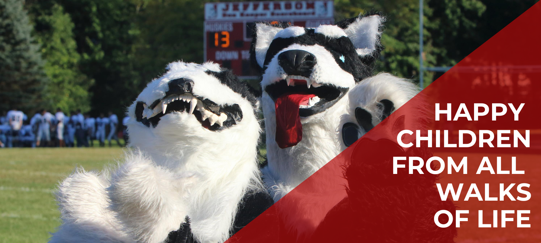 Happy Children from all walks of life over school mascot (wolves)