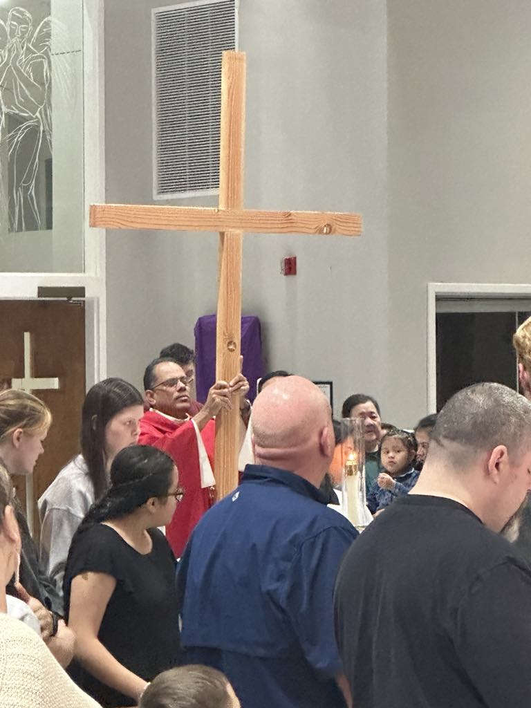 Fr. Antony begins procession with the cross