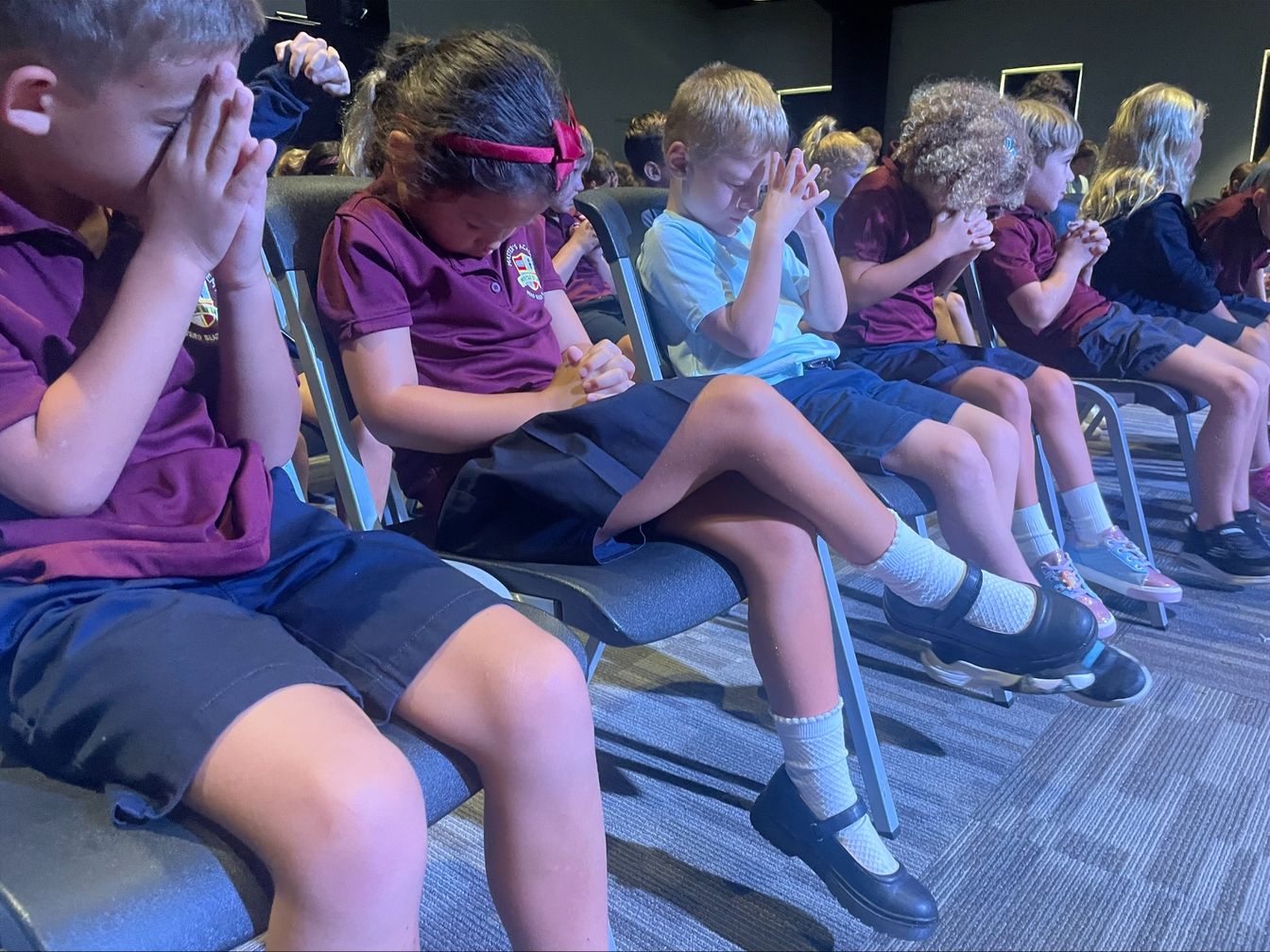 Lower School students praying