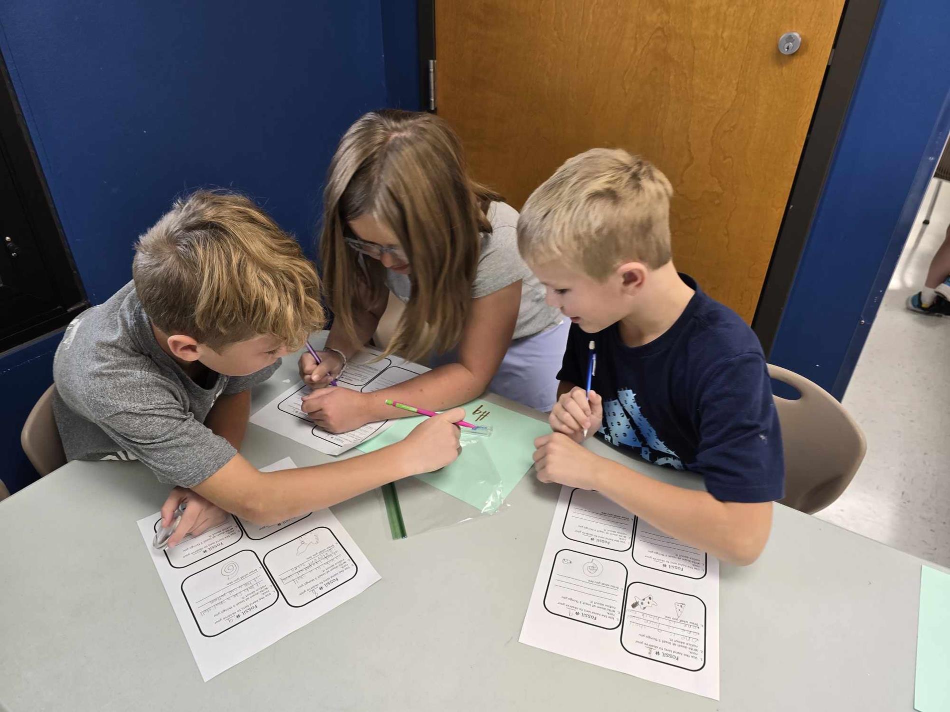 students examining rock