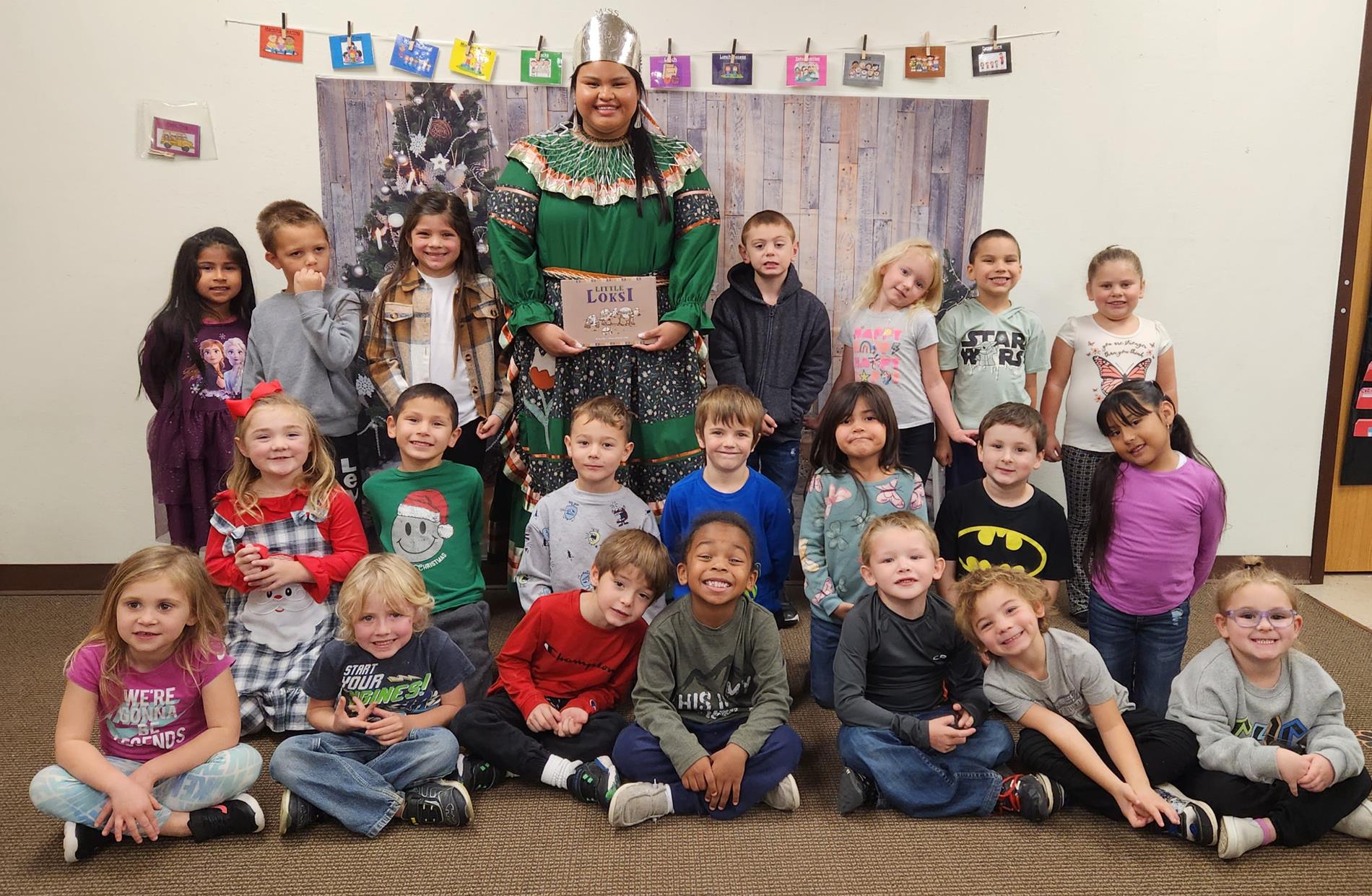 Chickasaw Princess Abby Gains poses with Mrs. Cox's Kindergarten class at Ada Early Childhood Center.