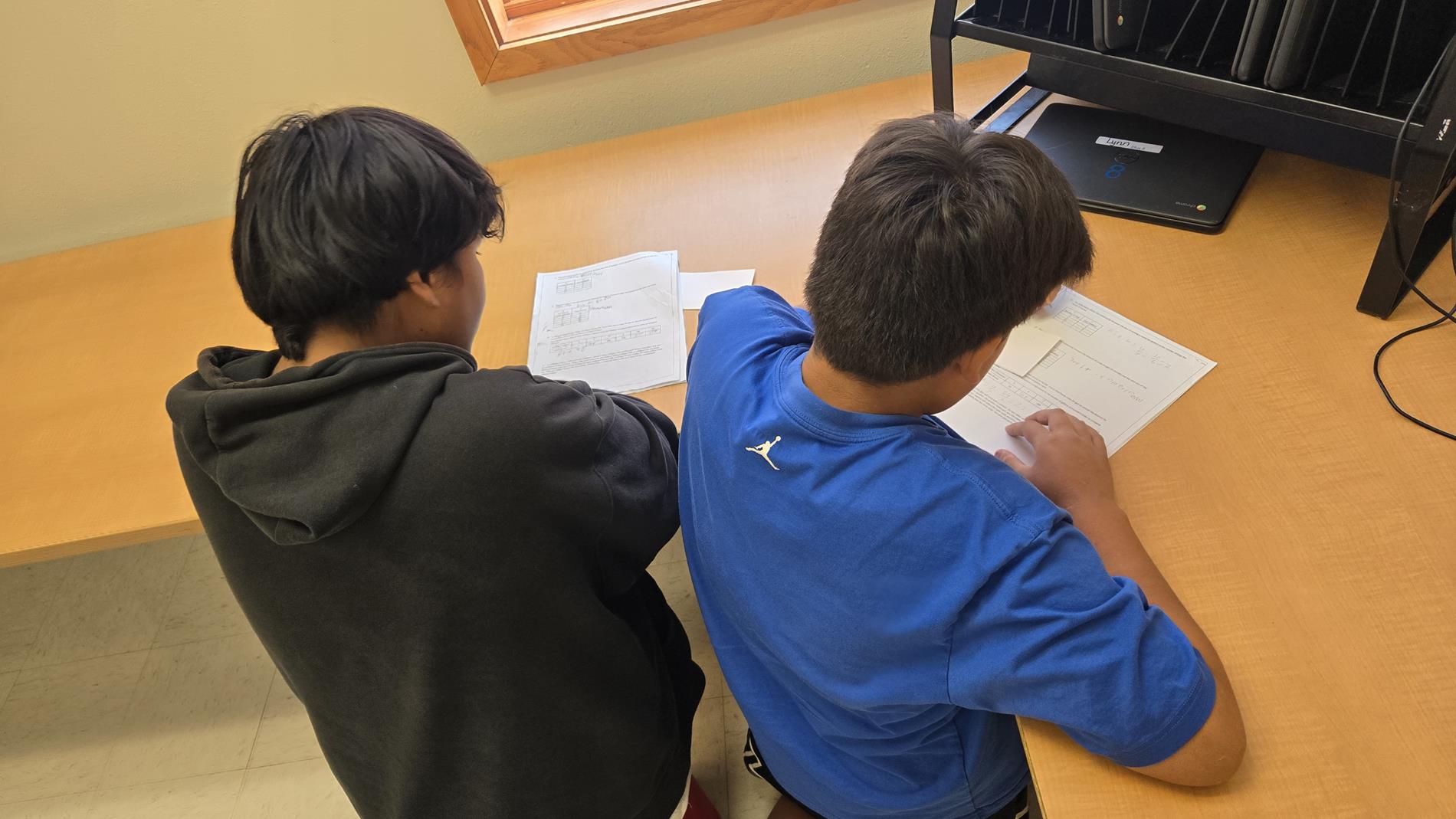 Creating a story based on the proportional relationship table they made.