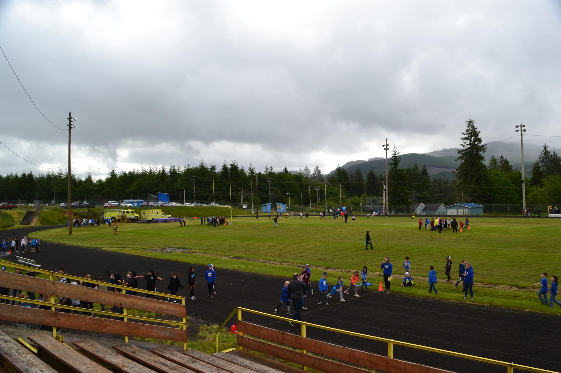 Wide view of the field and students playing at various events