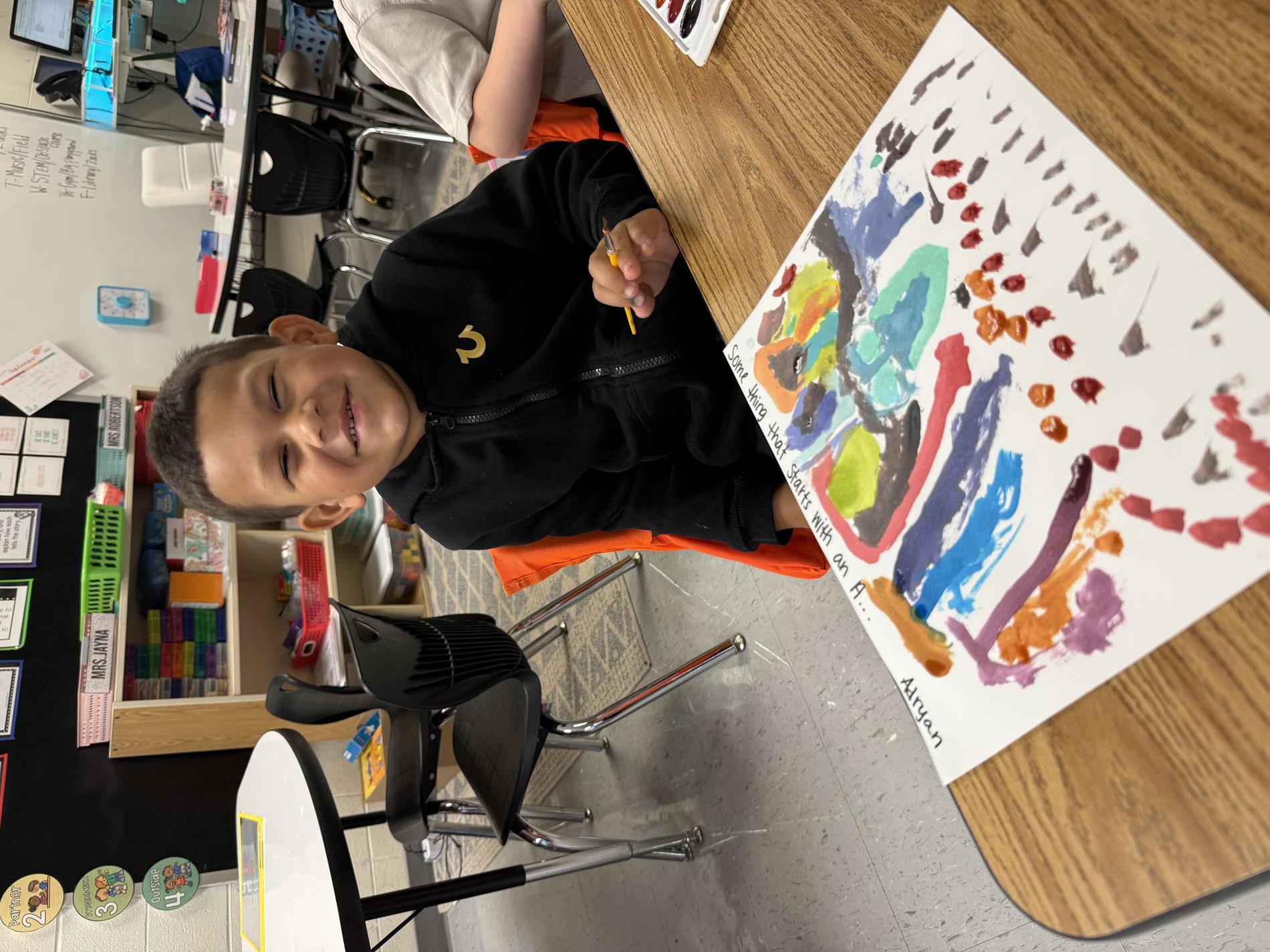 Kindergartener working on art project