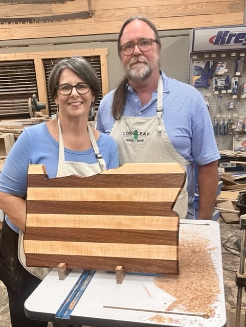 My husband and I on a date night at a woodshop.