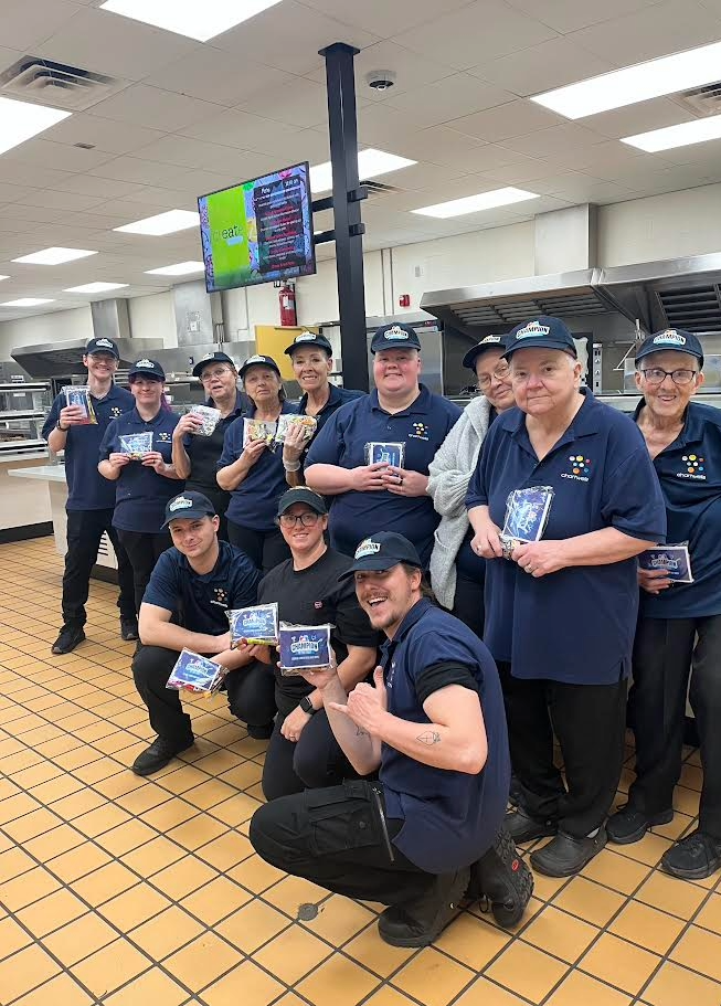Food Service workers posed for photo in kitchen