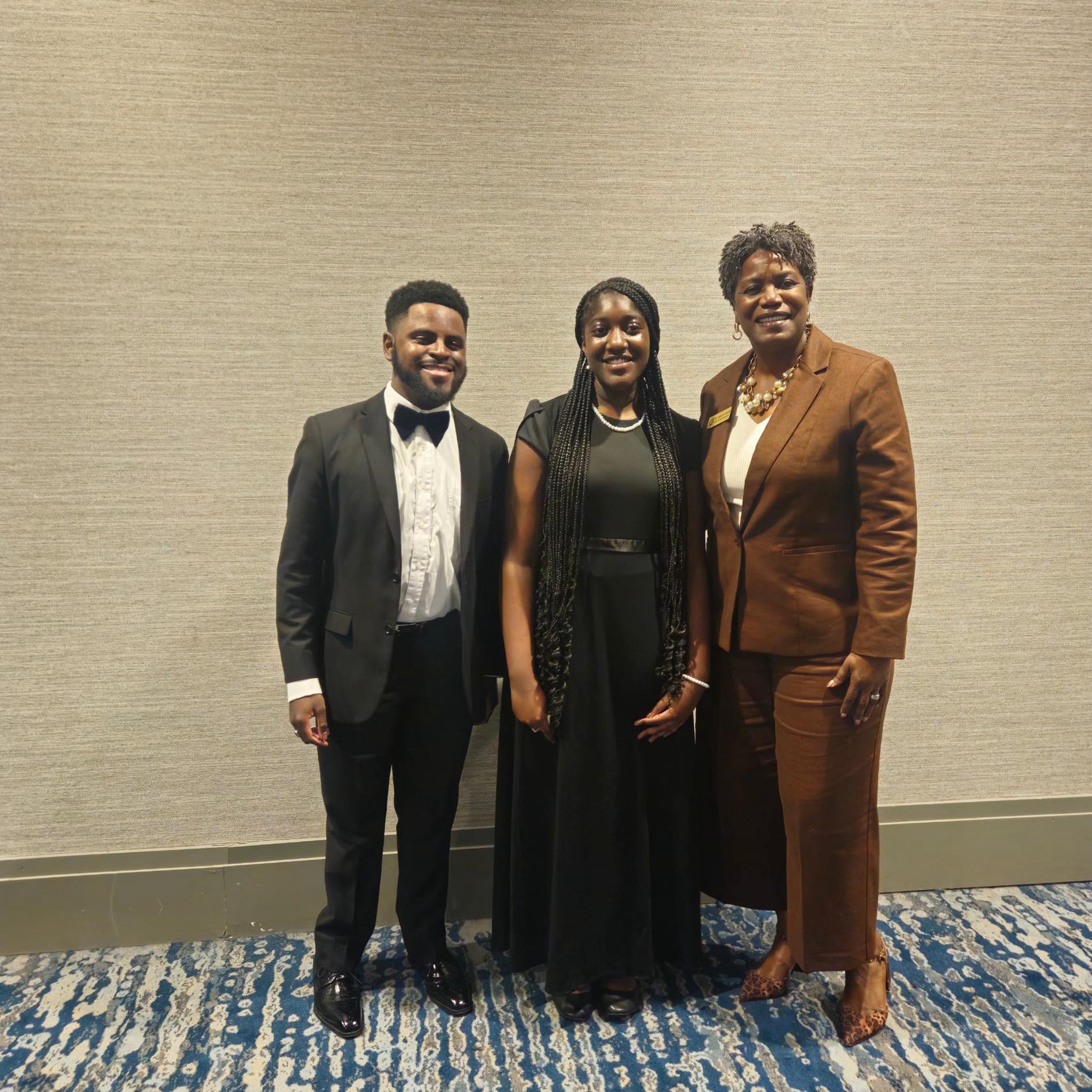 three people standing 