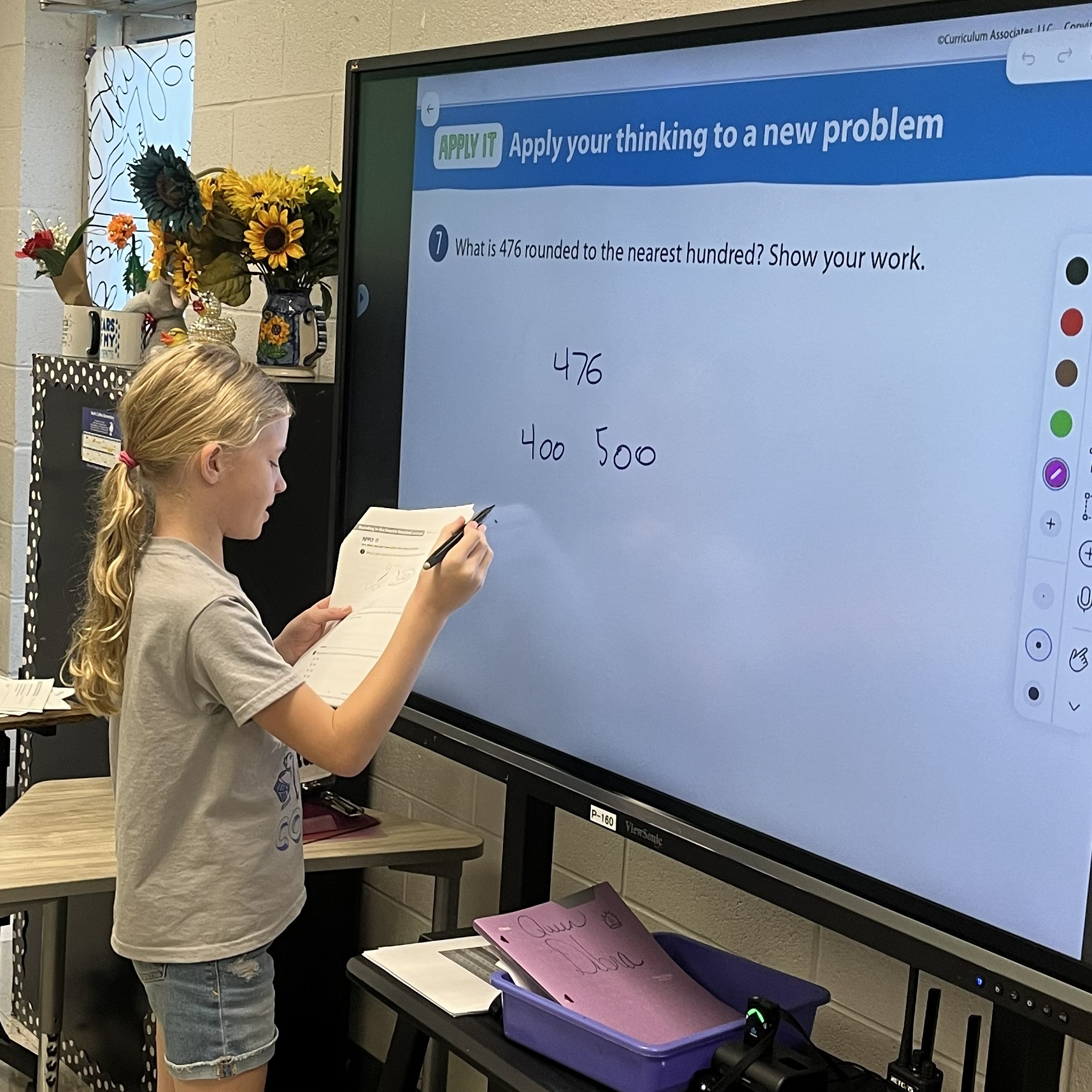 Student demonstrates how to solve a math problem