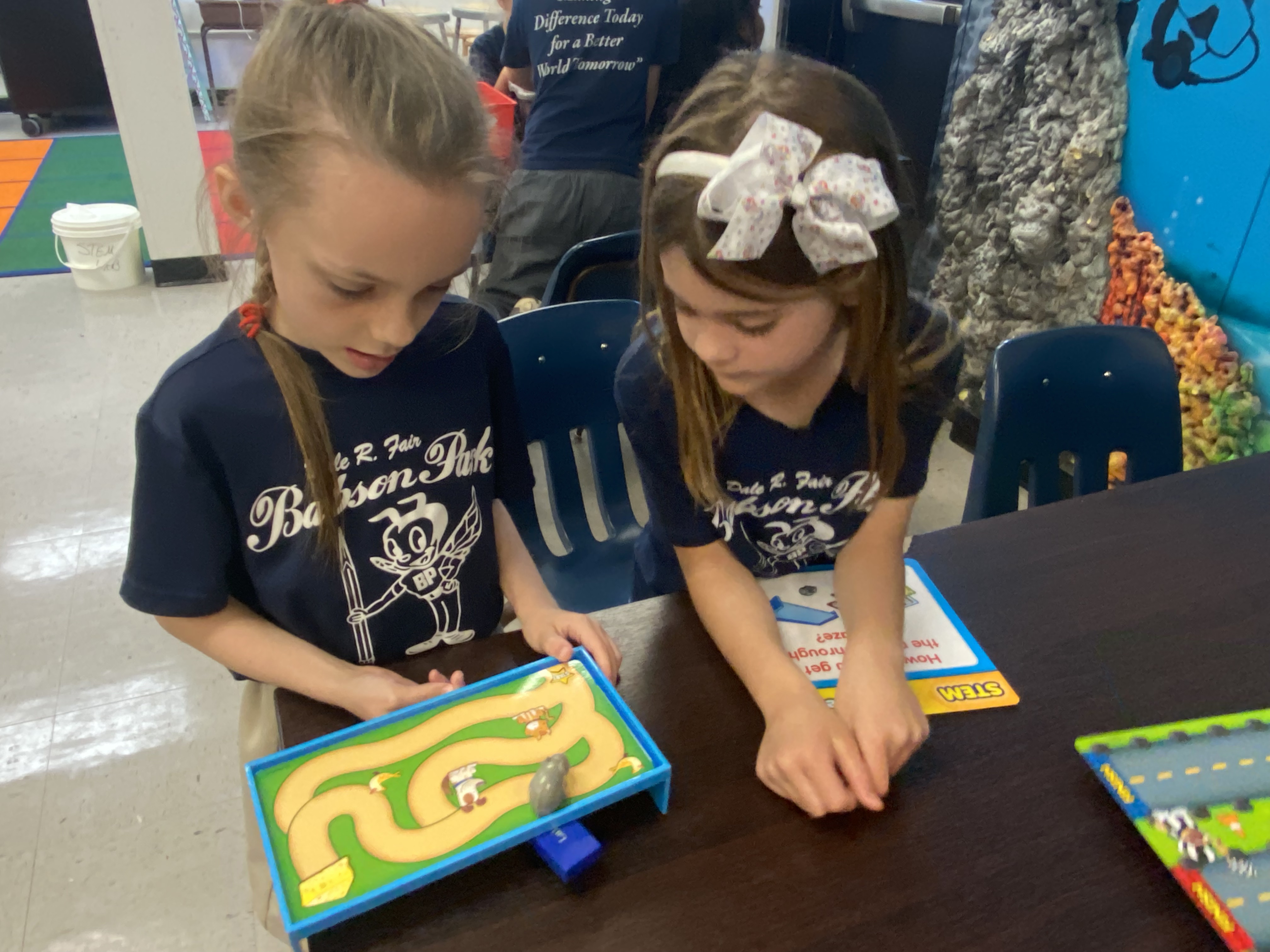 1st Grade students exploring magnets.