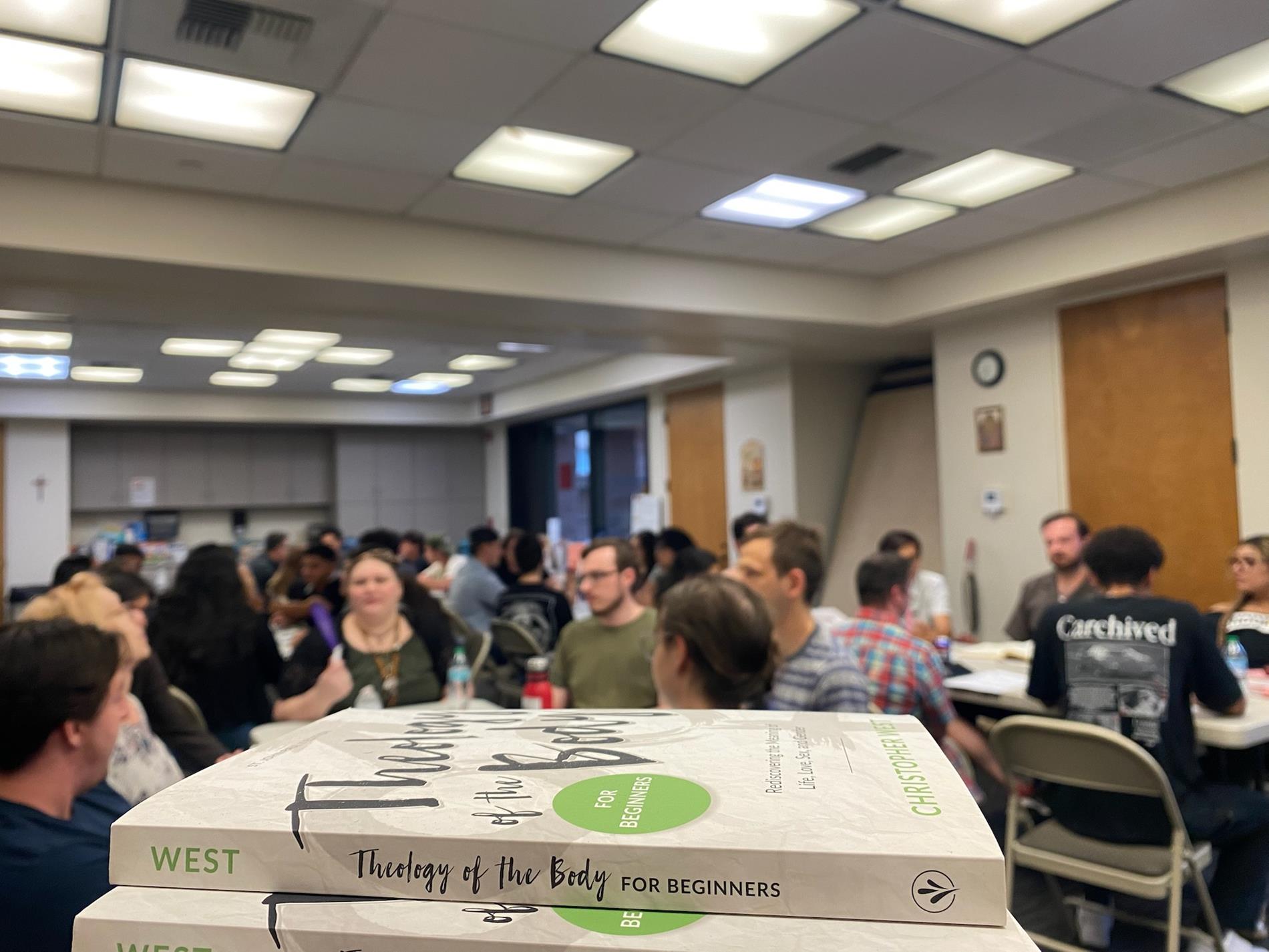 Young adults attending a Theology of the Body introductory presentation
