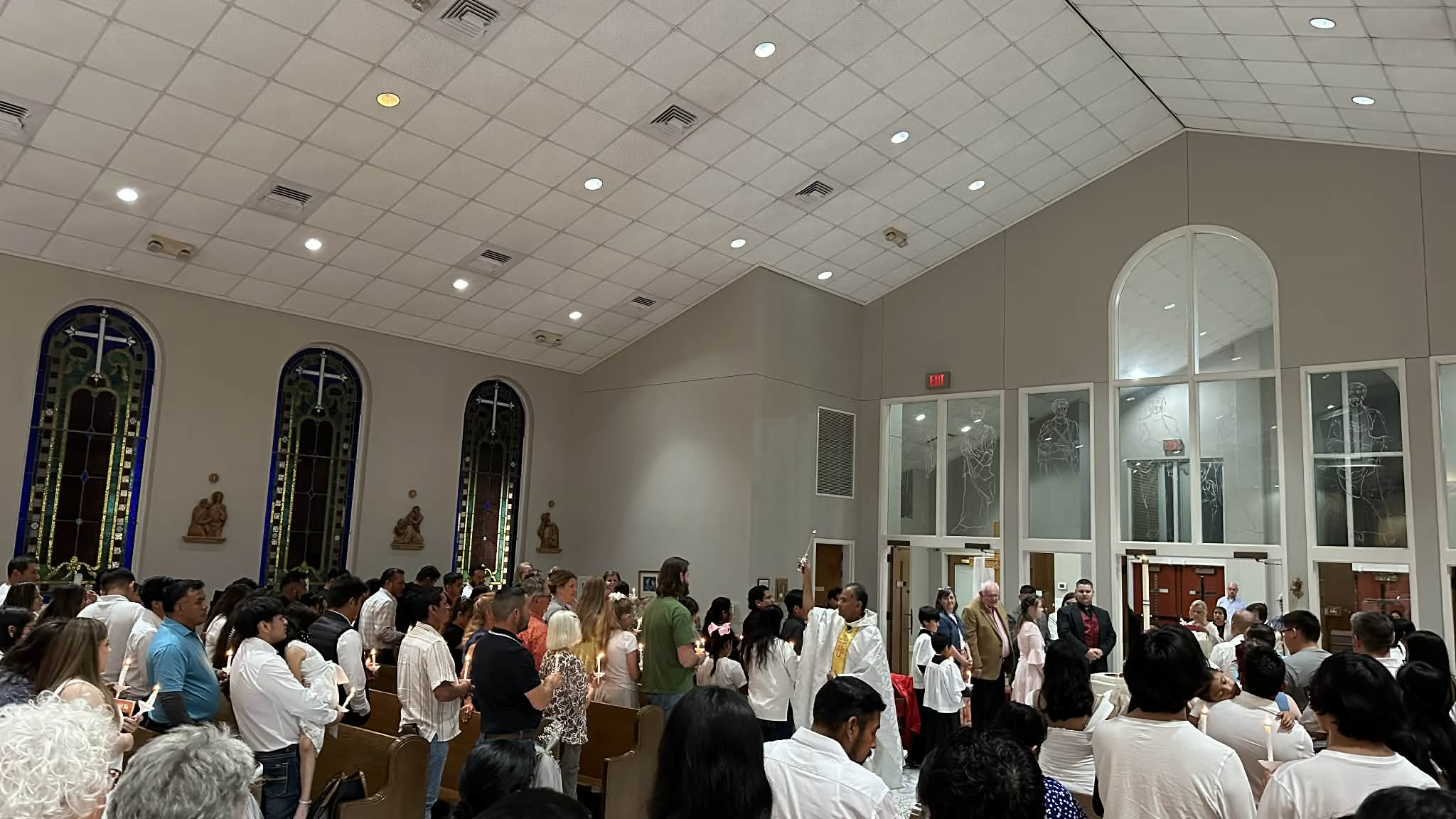 Congregation is sprinkled with Holy Water