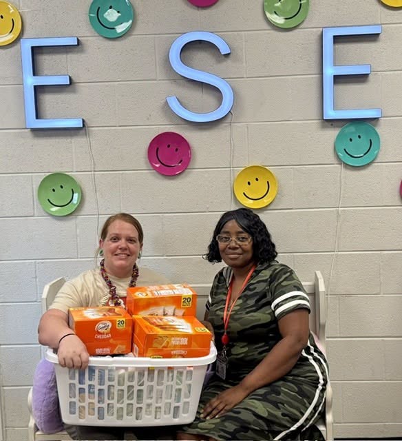 East Side Elementary staff members display snacks donated by the Junior Auxiliary of West Point for Mrs. Howard’s Pre-K class.