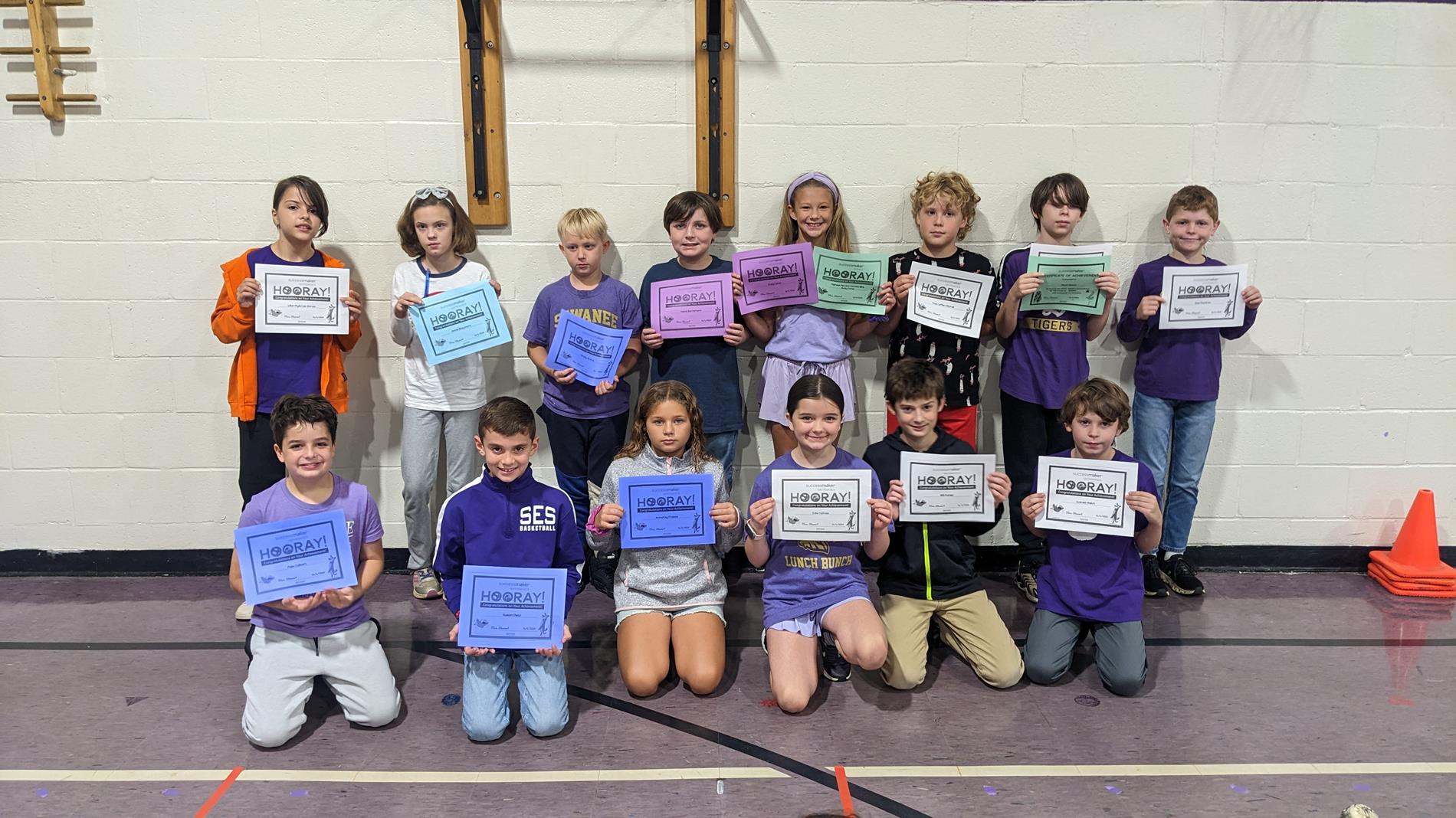 photo of 4th graders with math awards certificate