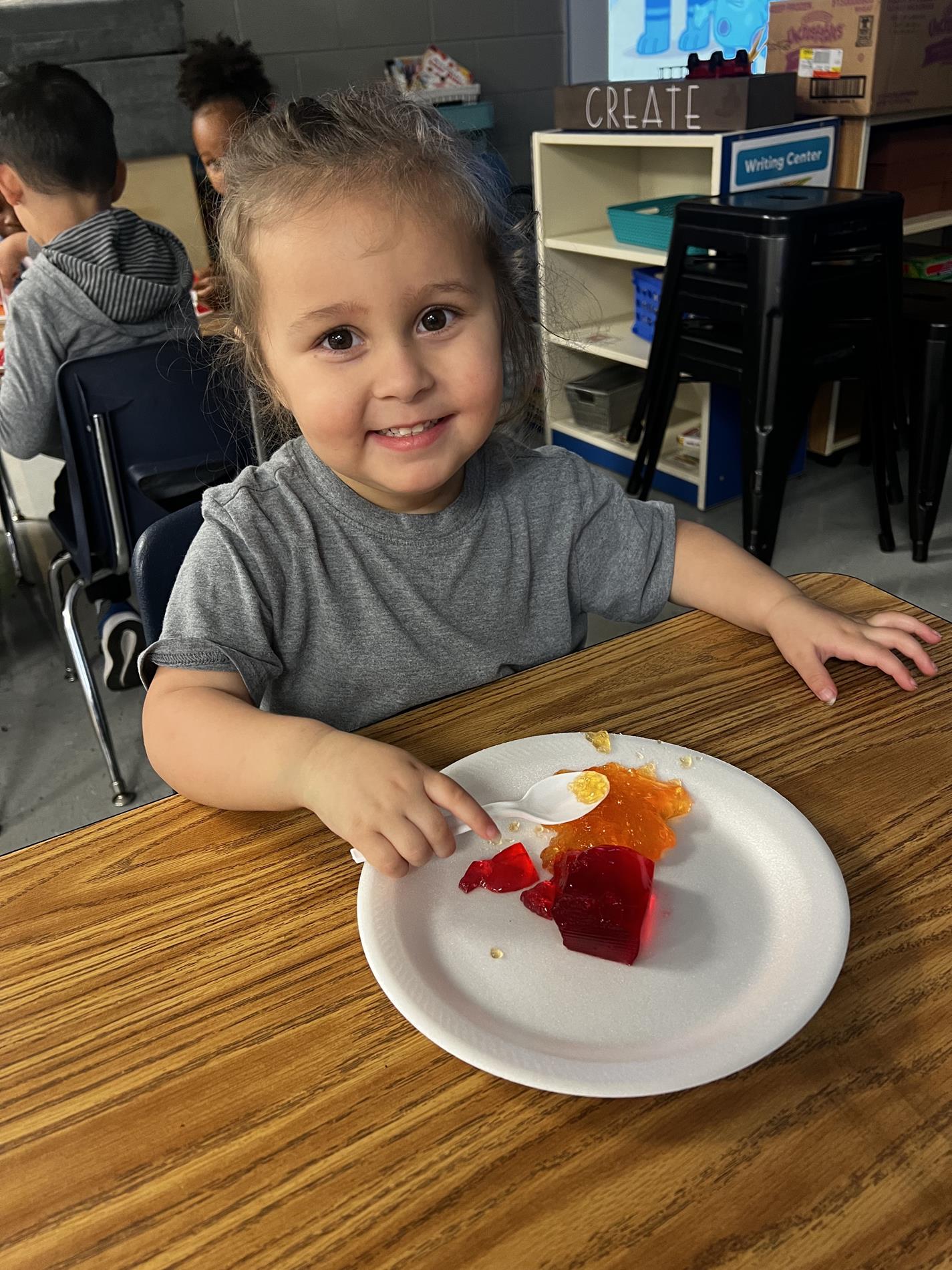 Preschoolers trying a food connected to letter of the week