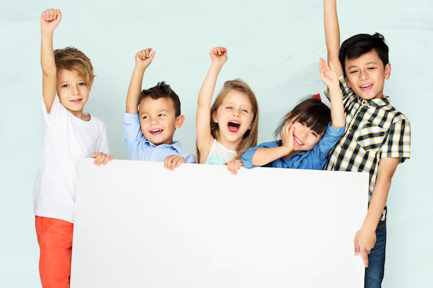 Happy kids holding white posterboard