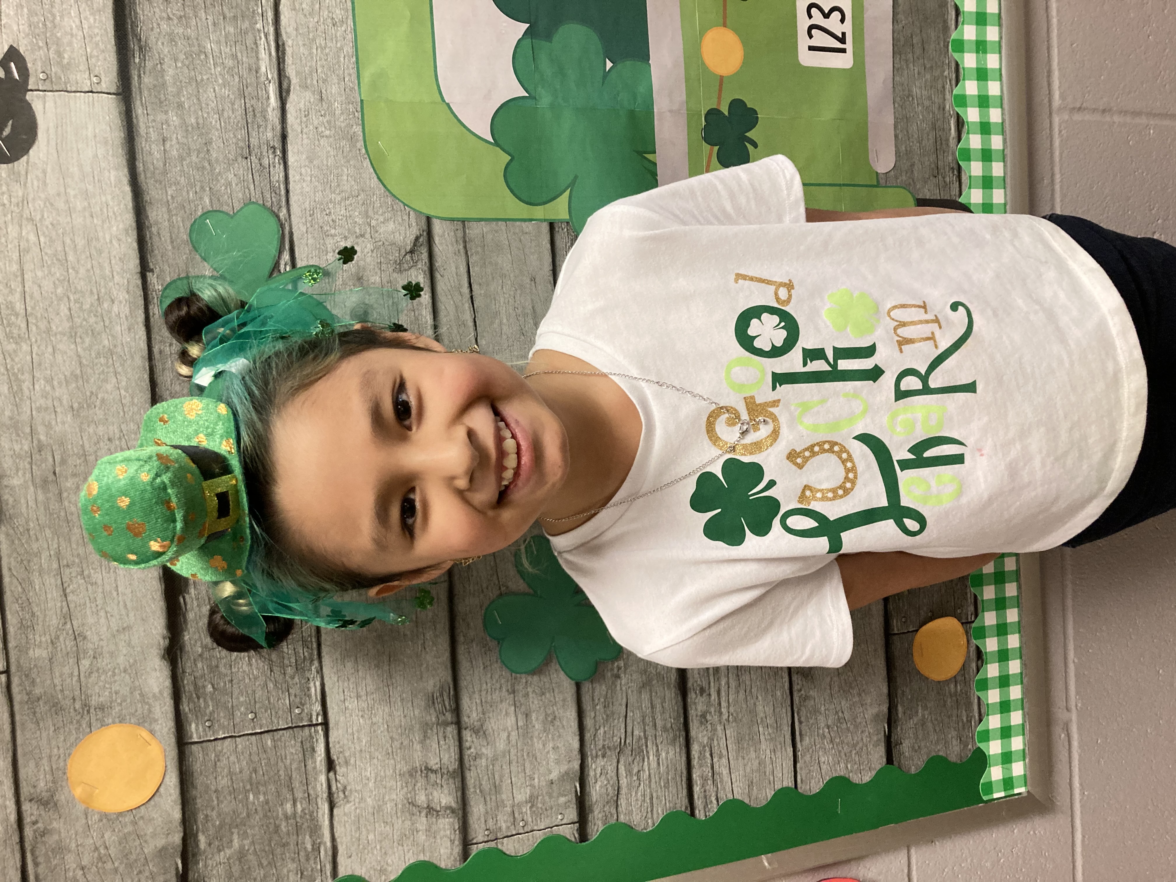 Elementary Student wearing silly St. Patrick's Day hat