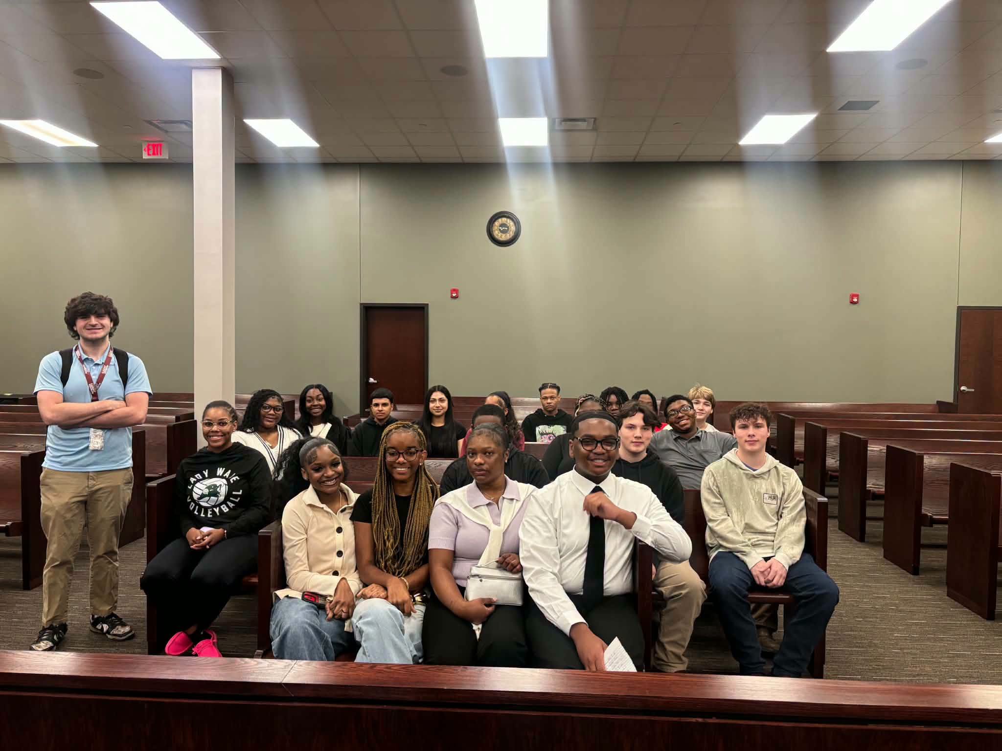 WPHS–South students and their teacher pose together inside the Circuit Court courtroom during an educational visit.