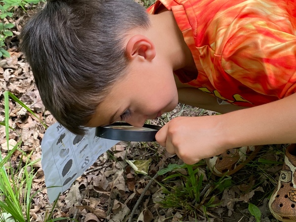 Boys with magnifying glass