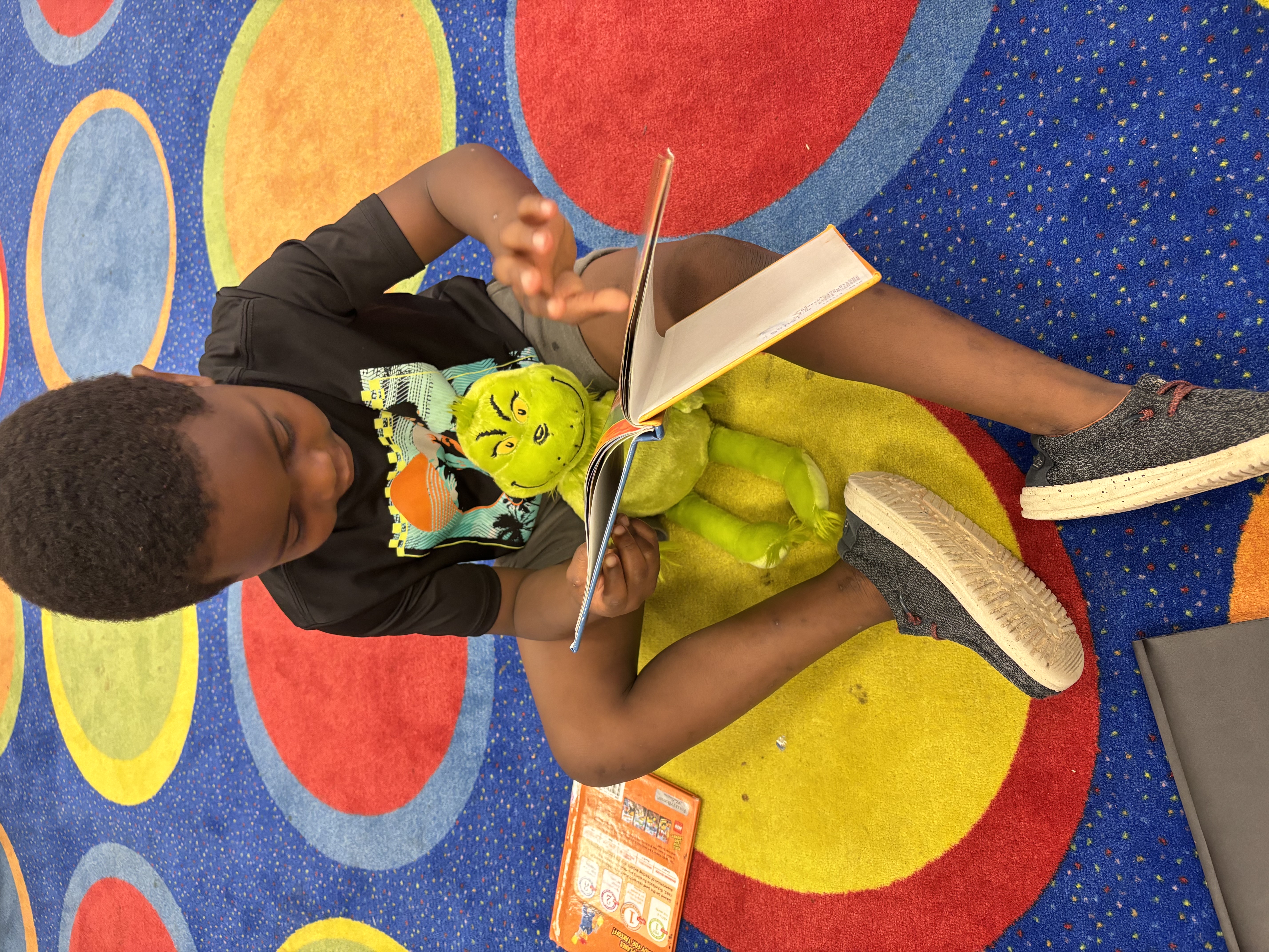 Student reading to book buddy