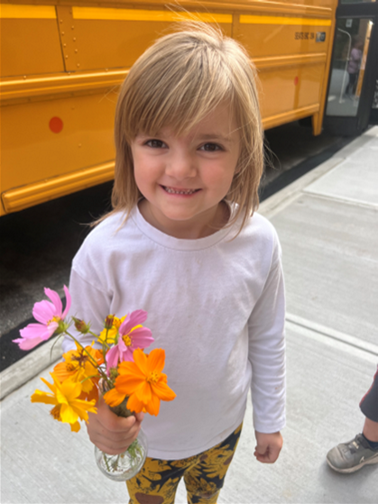 Student holding flowers