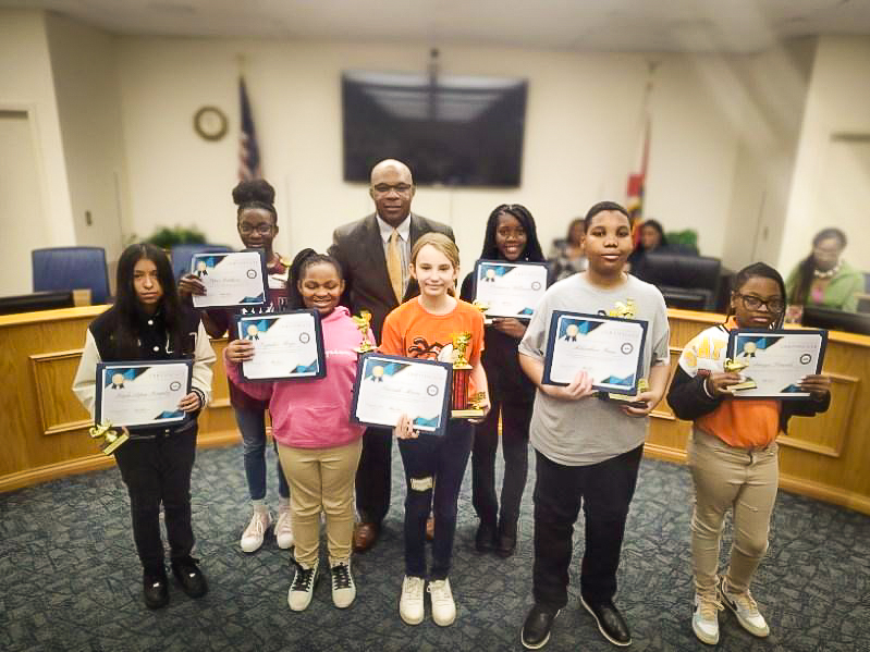 Superintendent Key and student spelling bee participants