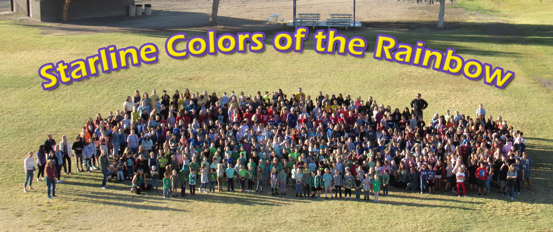 Starline students on field in rainbow colors