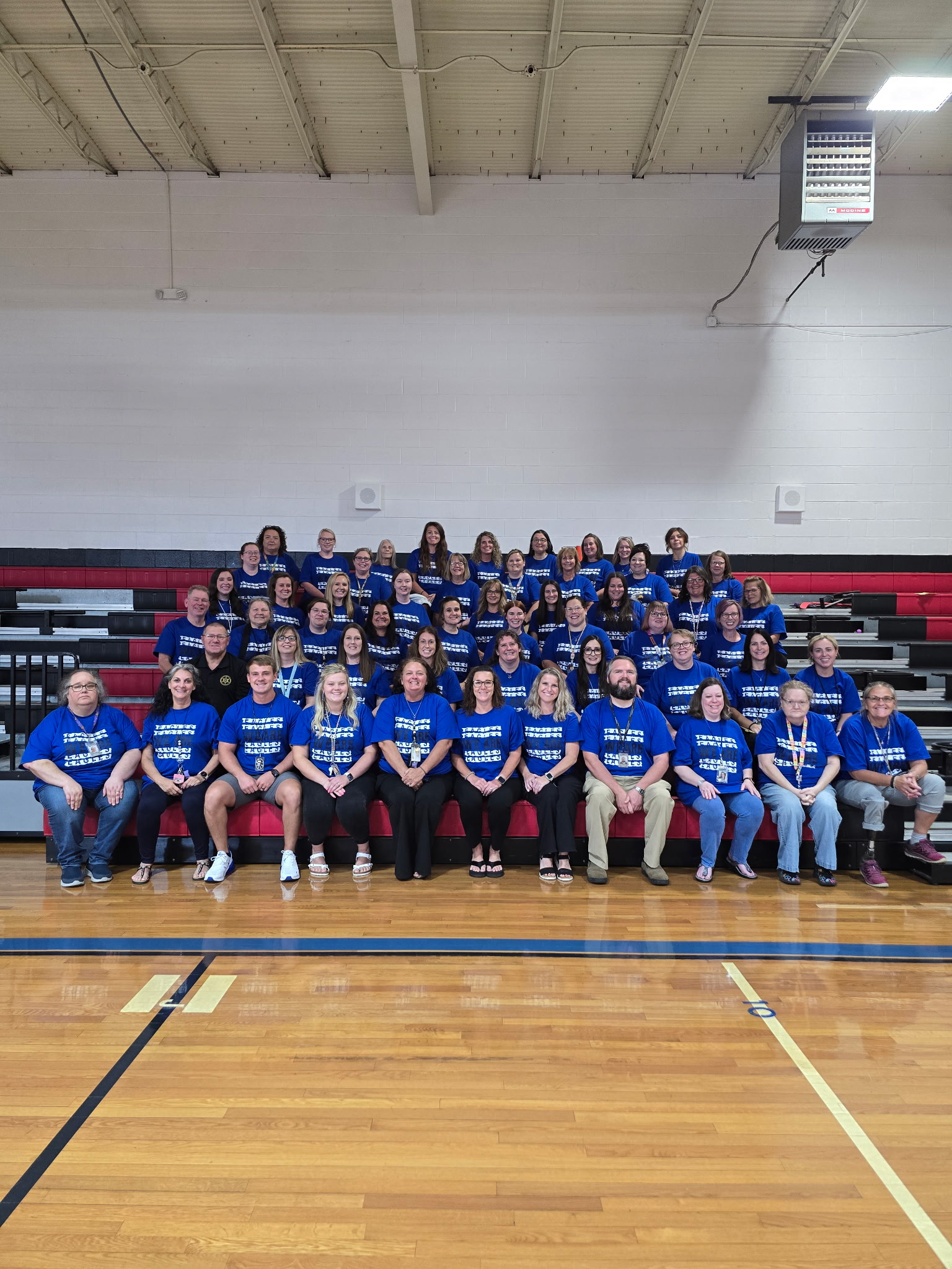 EHES Teachers posing for a group photo in the gym