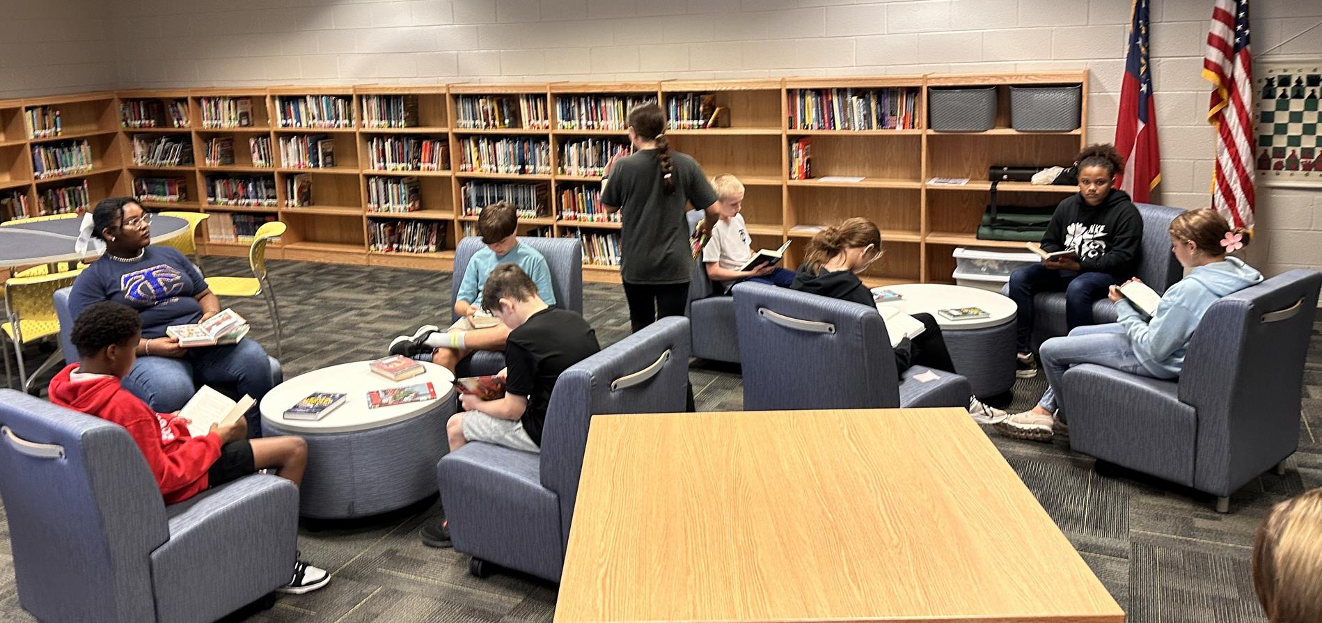 Students checking out books in the library. 