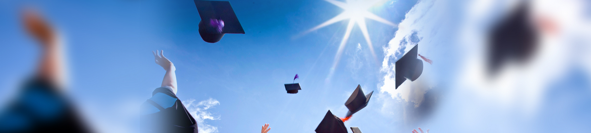 throwing graduation caps in air