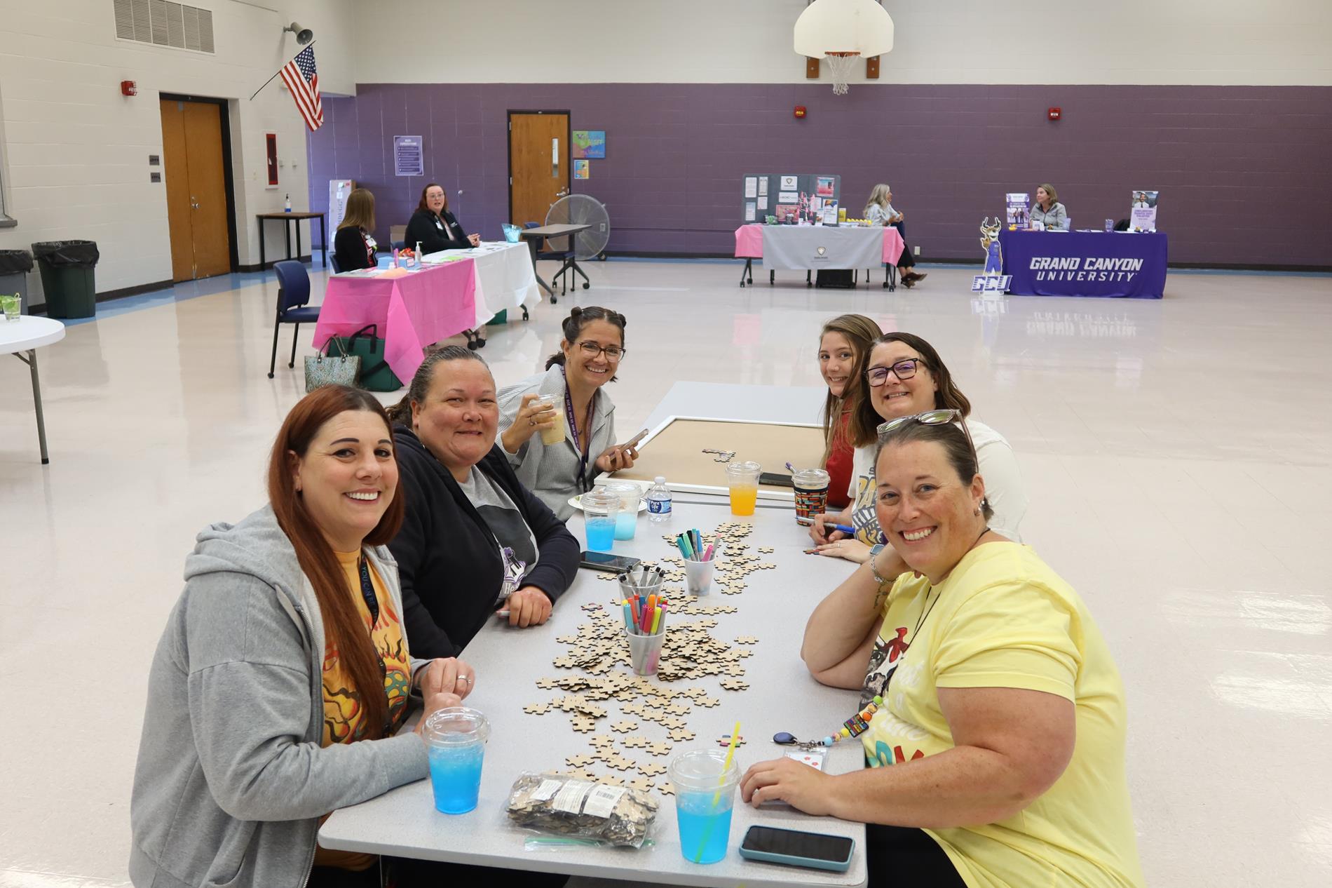 ROE #33 staff sitting around table at Wellness Fair 2025