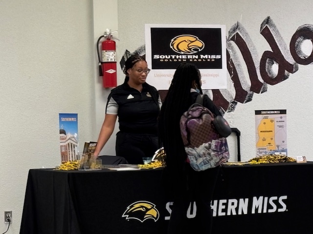 Students talking with Southern Mississippi University