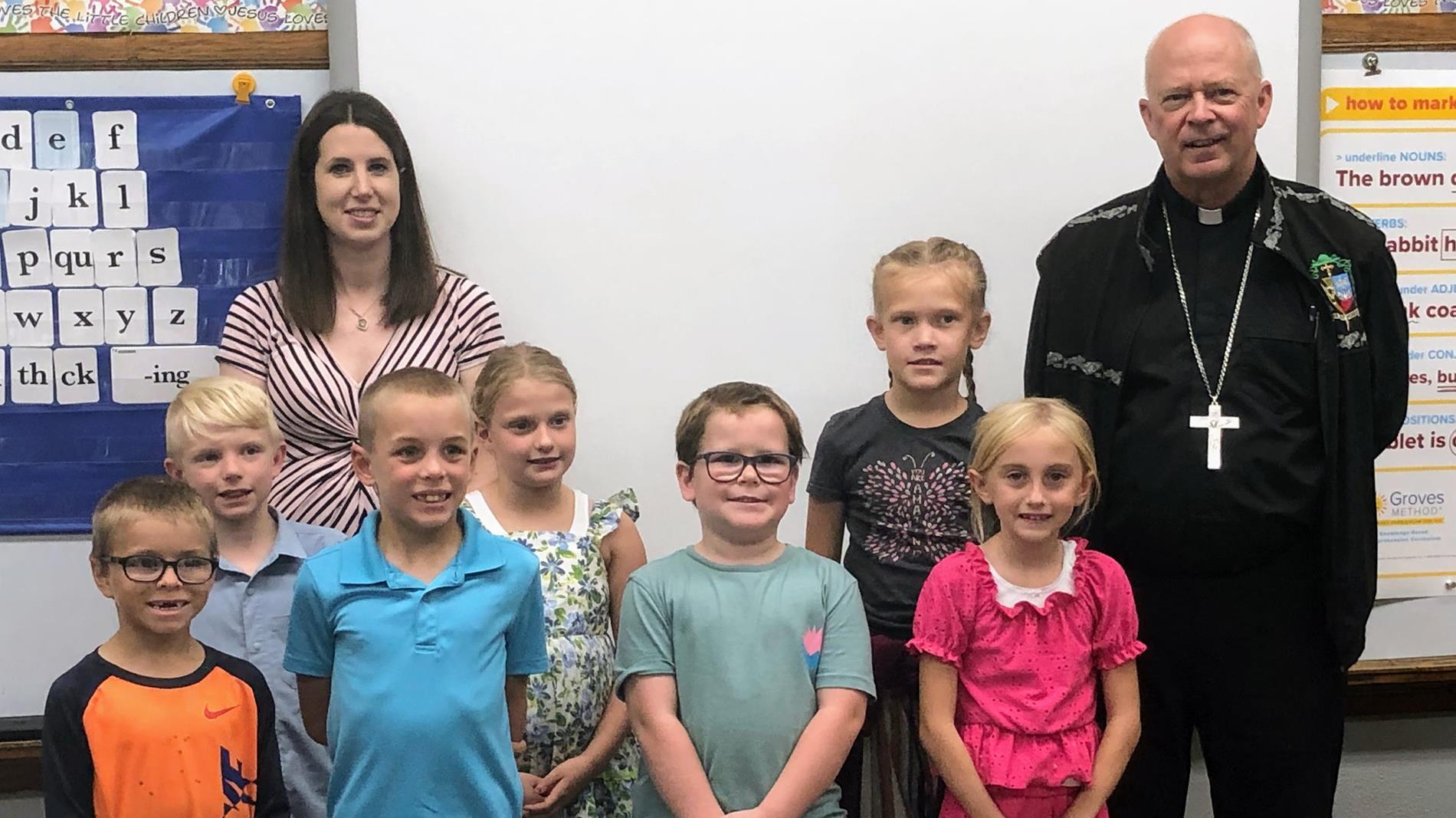 Children Standing with the Bishop