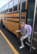 Girl leaving a school bus