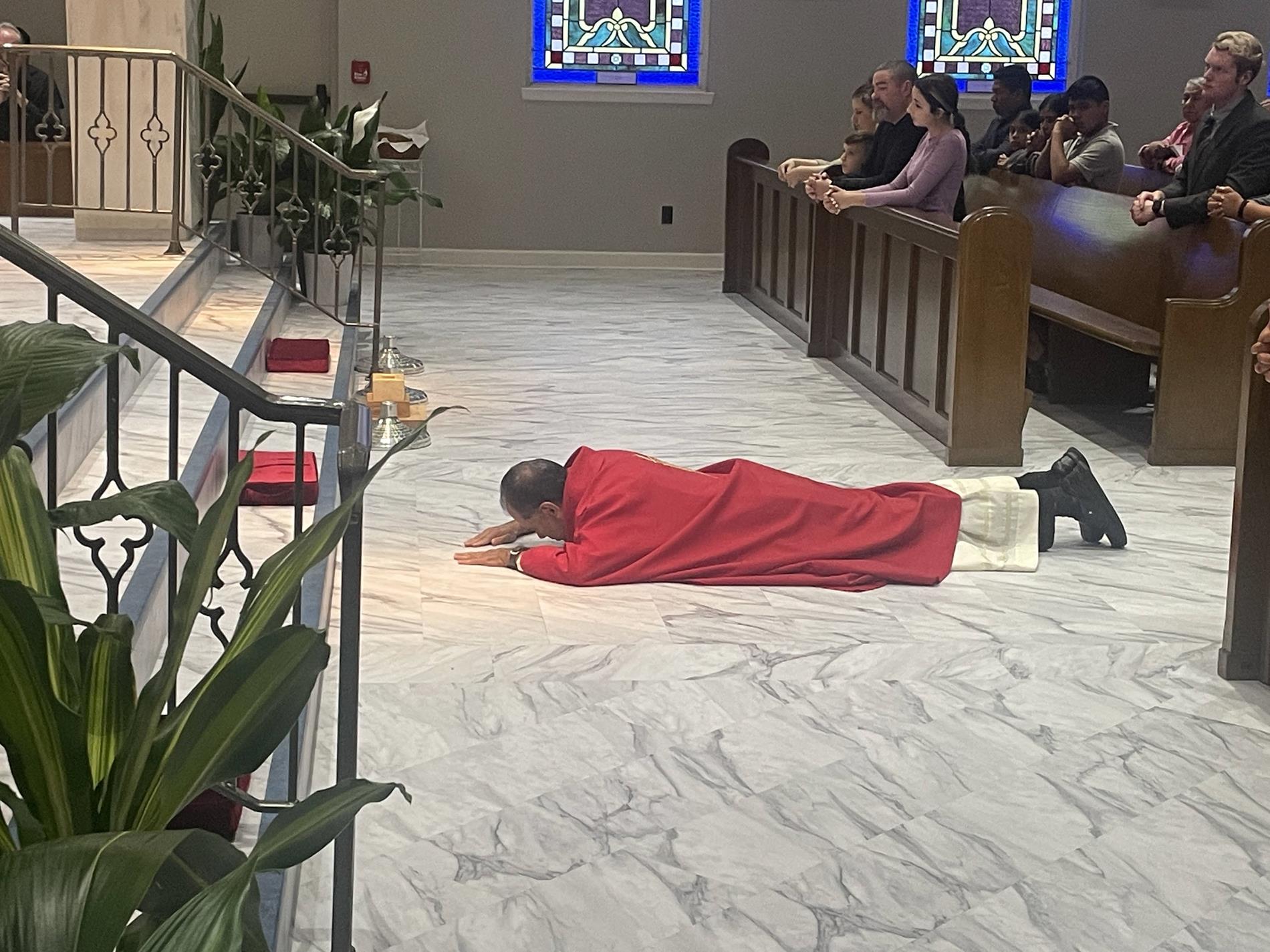 Fr. Antony prostrates himself before the altar