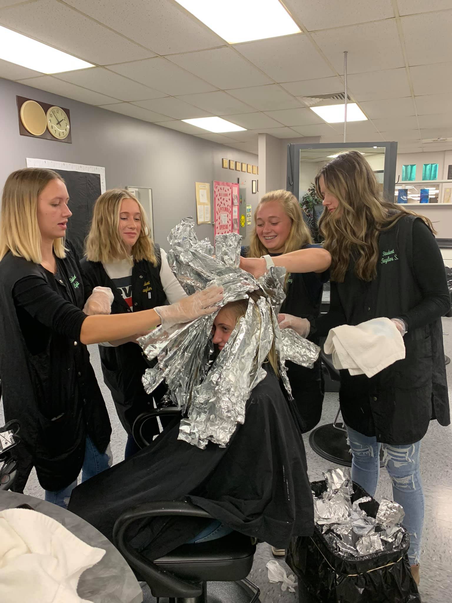 Teamwork for a color in the salon.