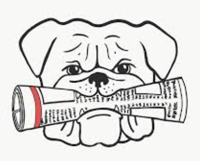 Bulldog with paper in its mouth
