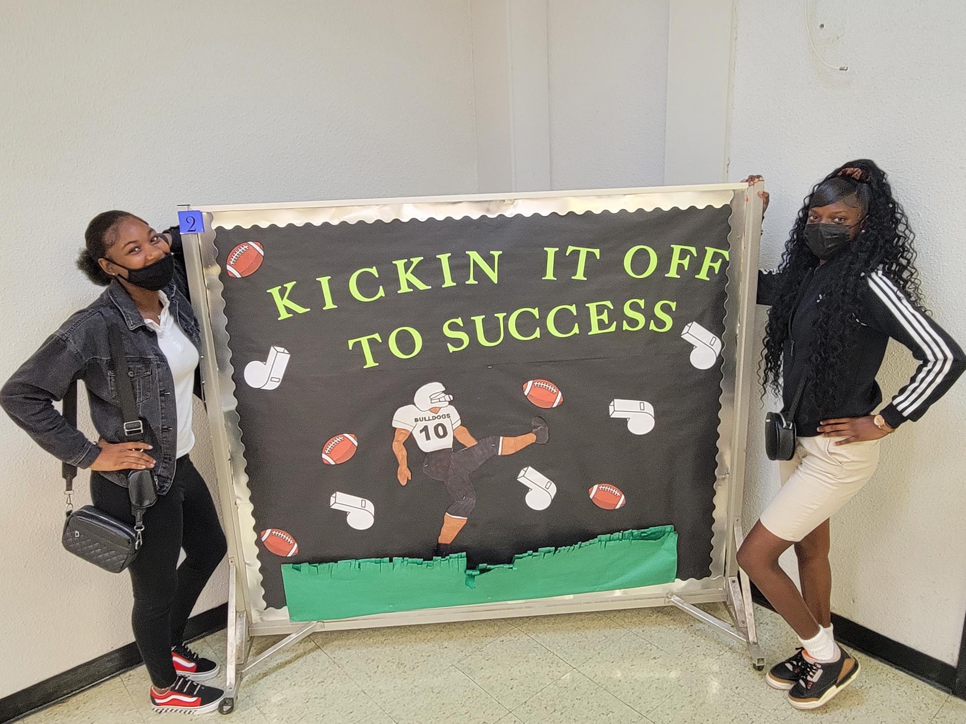 Students display kickin it off to success board