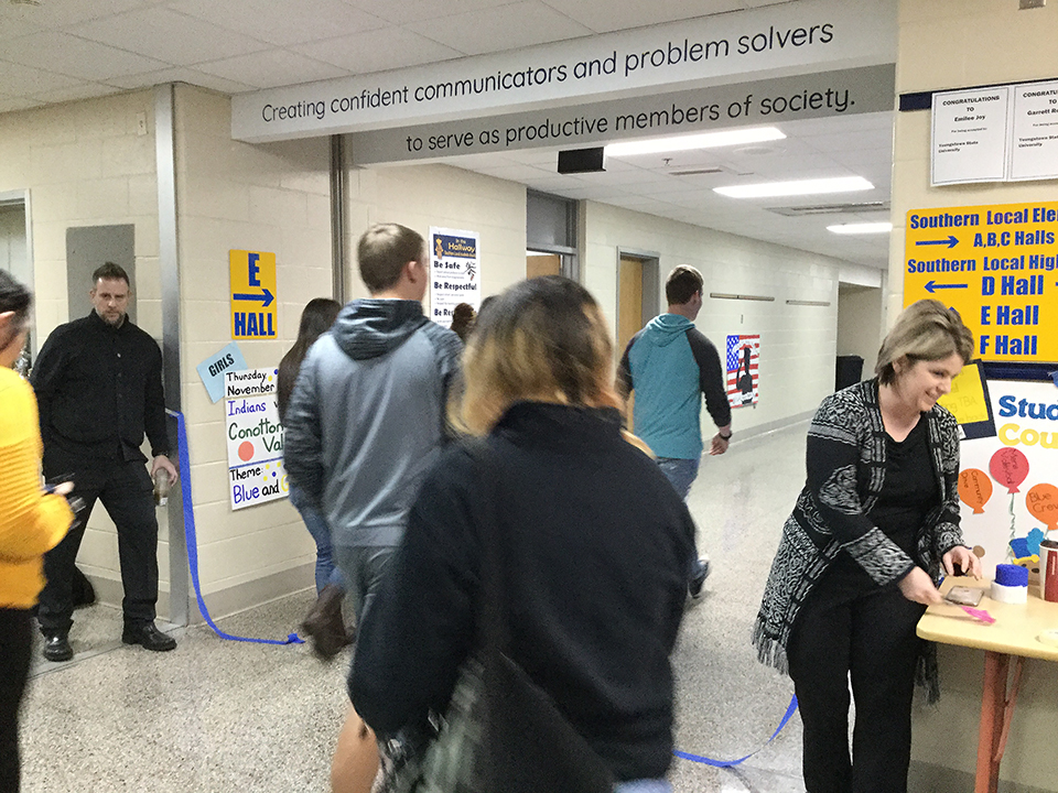 students enter the hallway