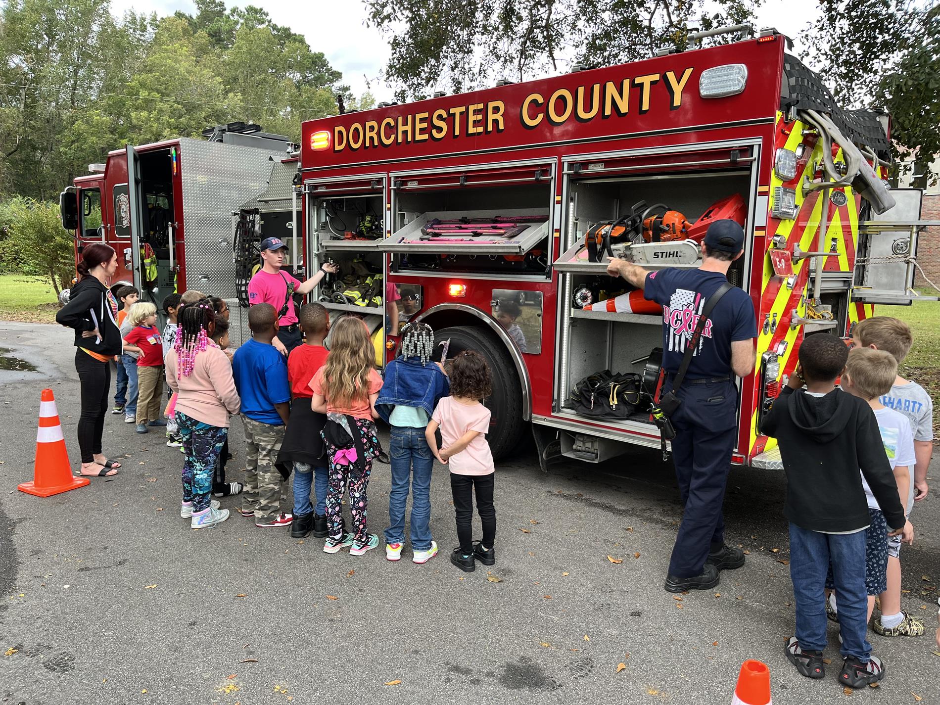 elementary students looking at fire truck