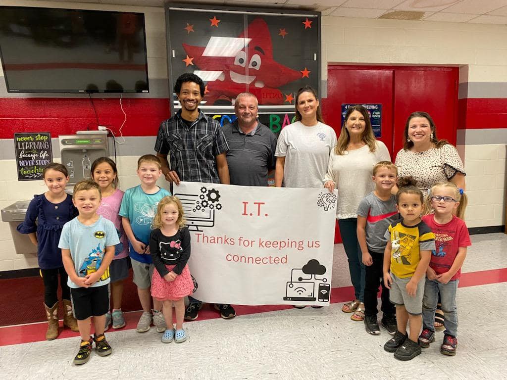 Tech team with staff and students