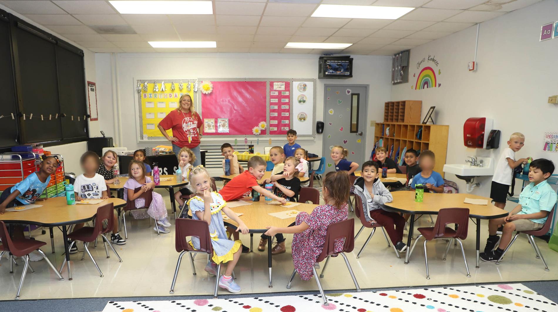 students sitting in classroom tables