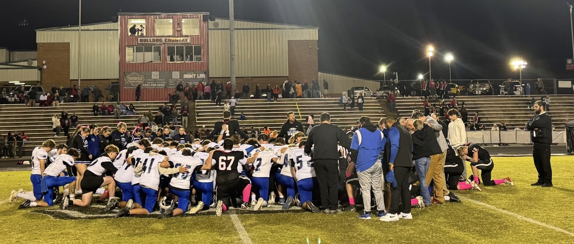 Bulldogs and Eagles huddled together after the game