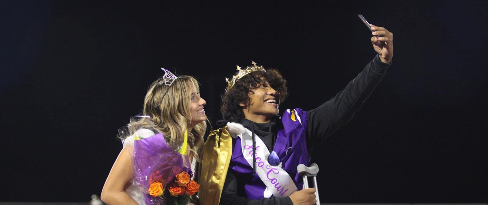 2022 LHHS Homecoming King and Queen taking a selfie