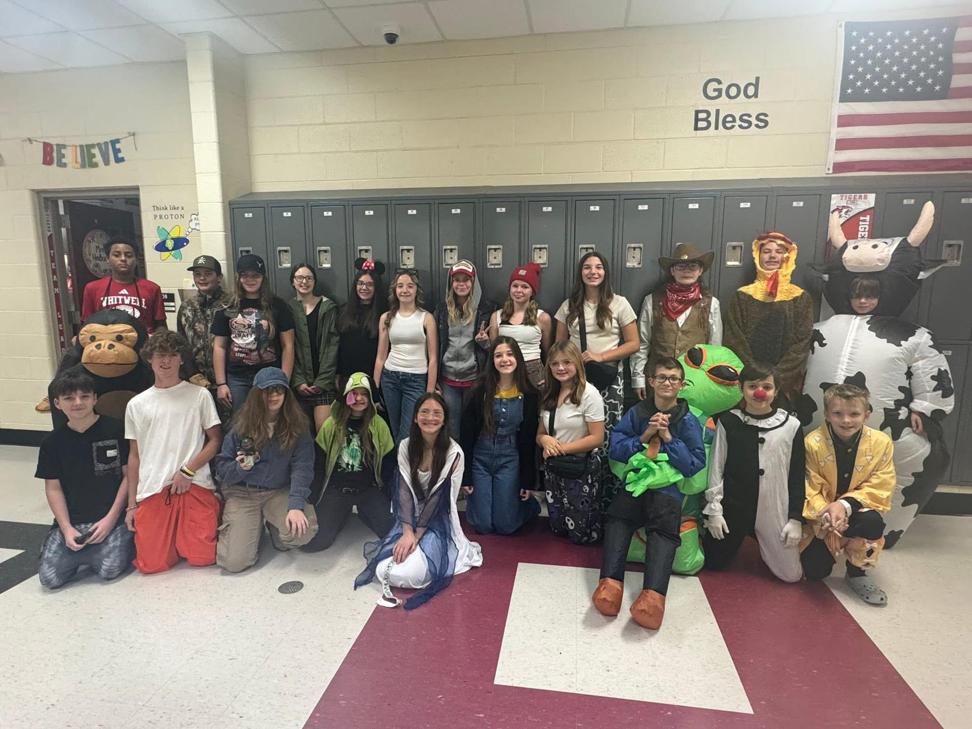 Group of students dressed in costume for Halloween.