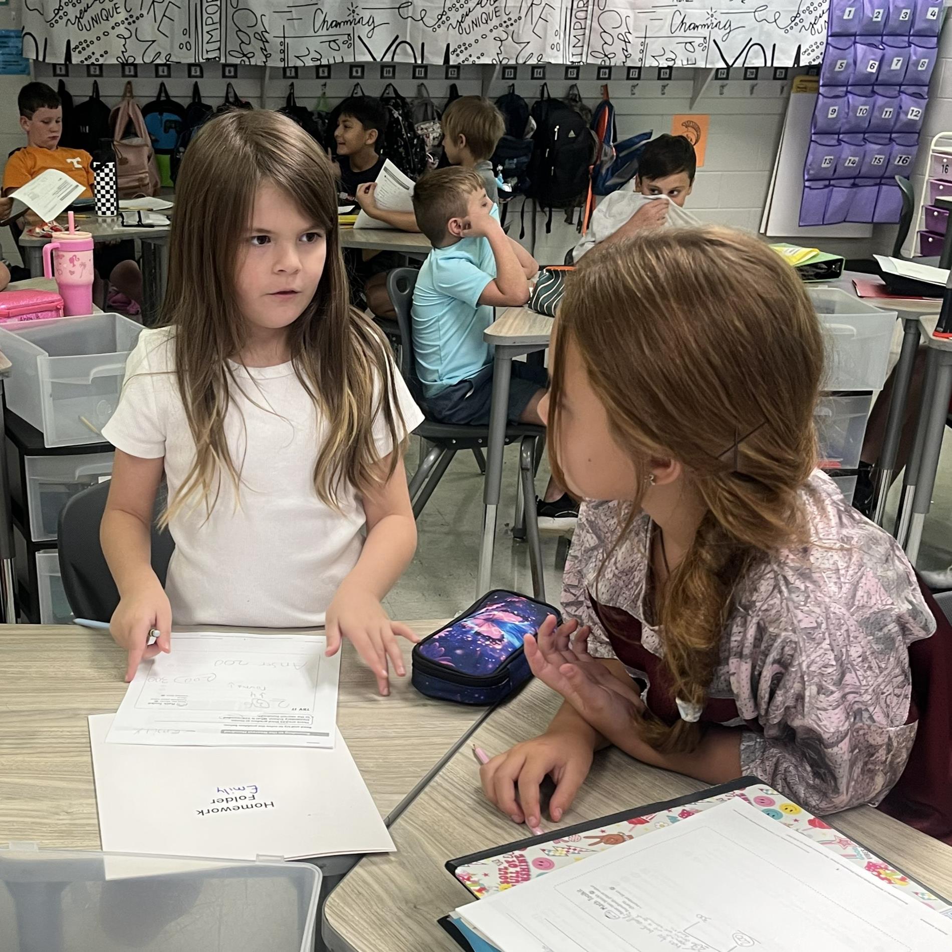 Girls working together to solve a problem